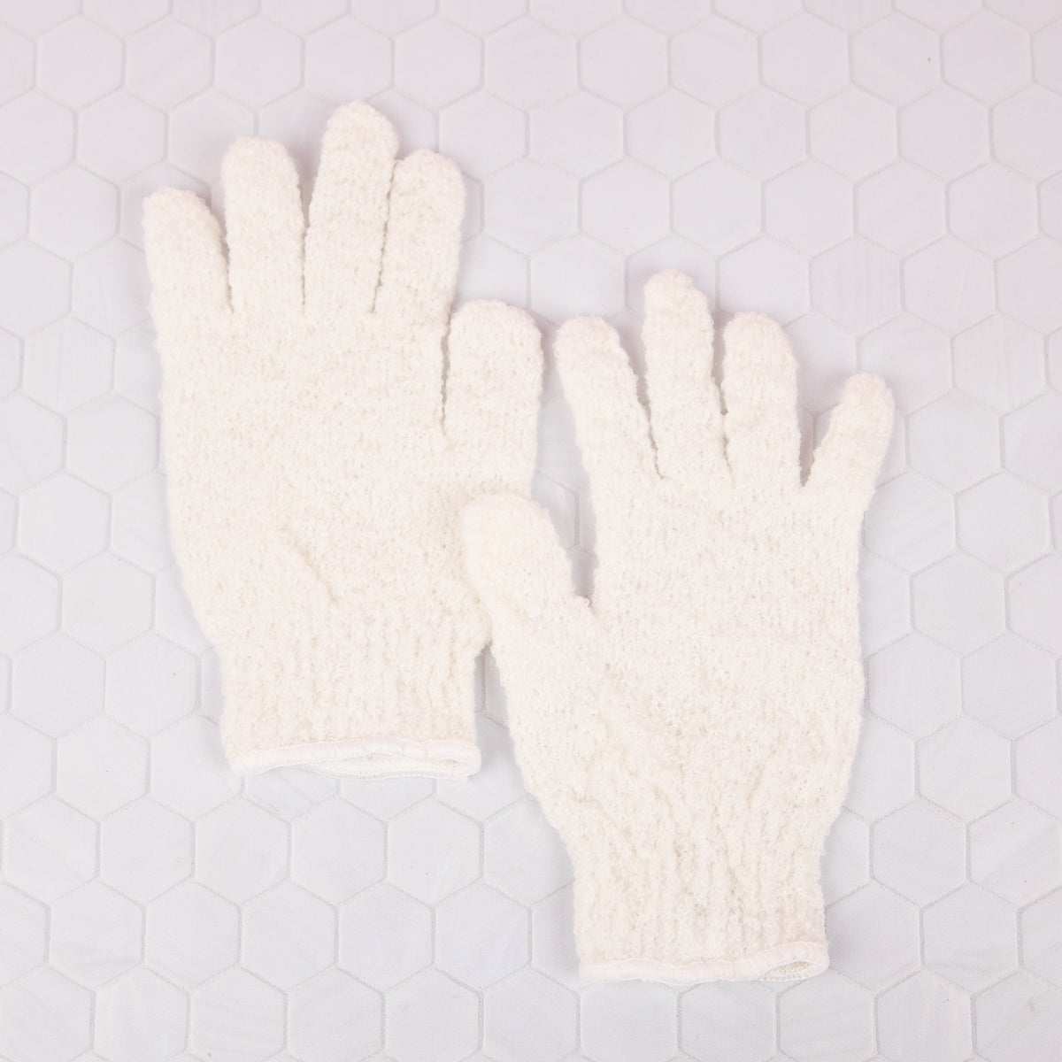 Exfoliating bath gloves
